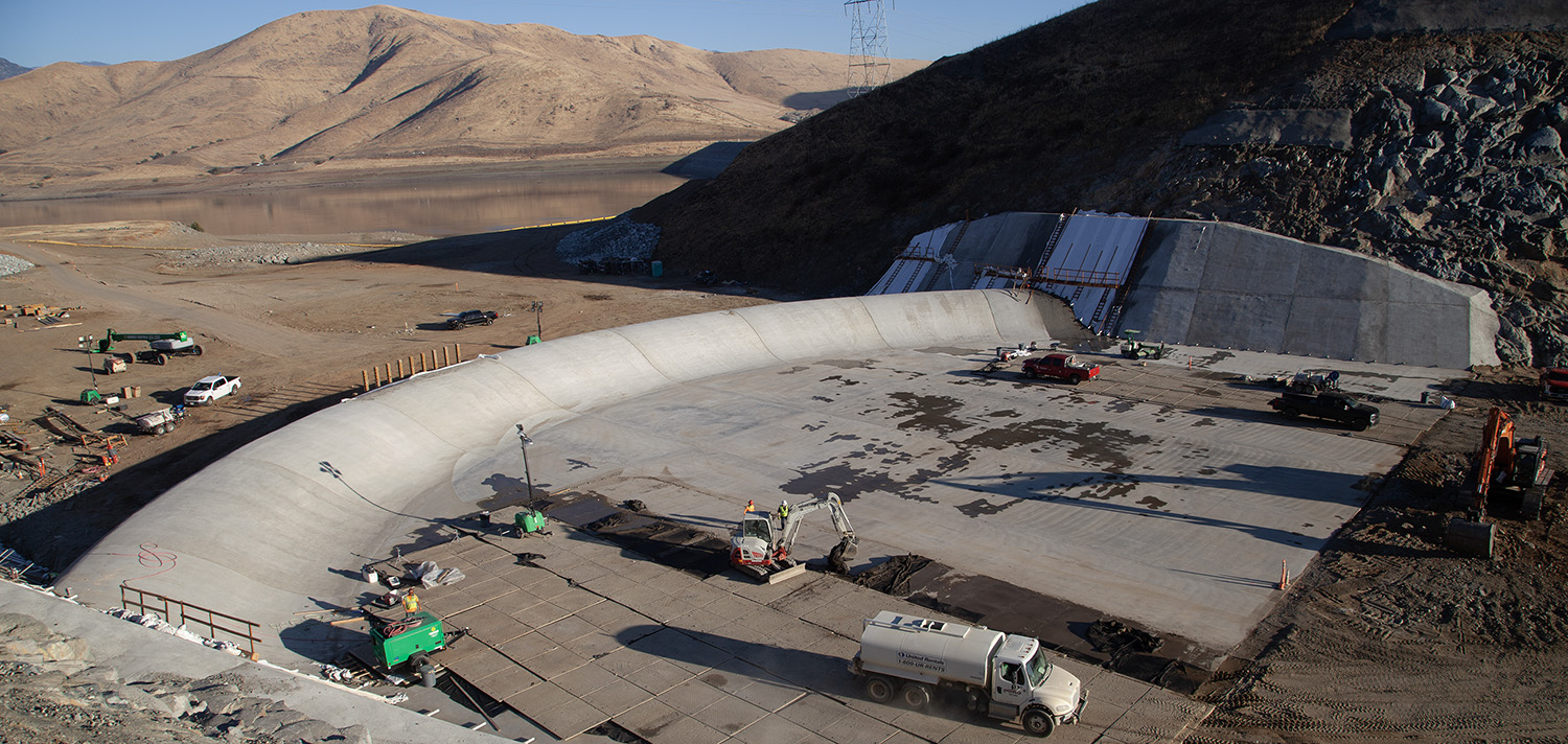 ​  Contracted construction teams complete the final steps of construction on the ogee weir within the Tule River Spillway at Success Lake, California, November 13, 2024.
